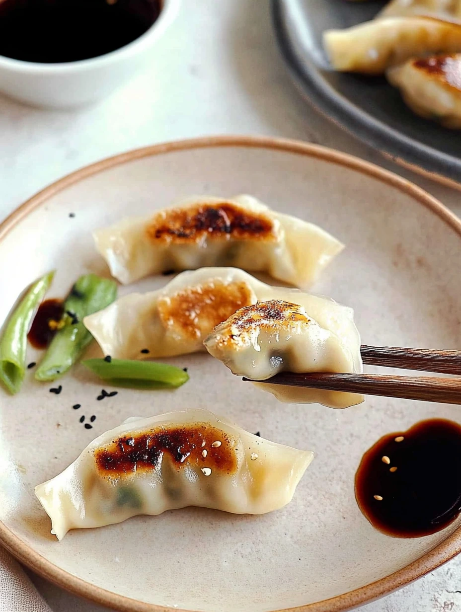 Taking a bite of vegetable gyozas