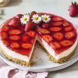 A fresh strawberry dessert with a biscuit crust.